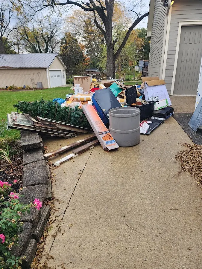 Dumpster being loaded with debris for Estate Cleanout Dumpster Rental in New Port Richey East